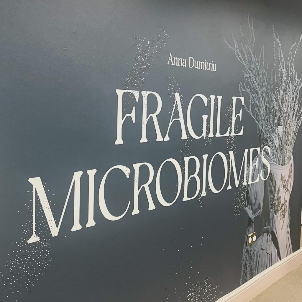 Main title sign for the exhibition "Fragile Microbiomes"
