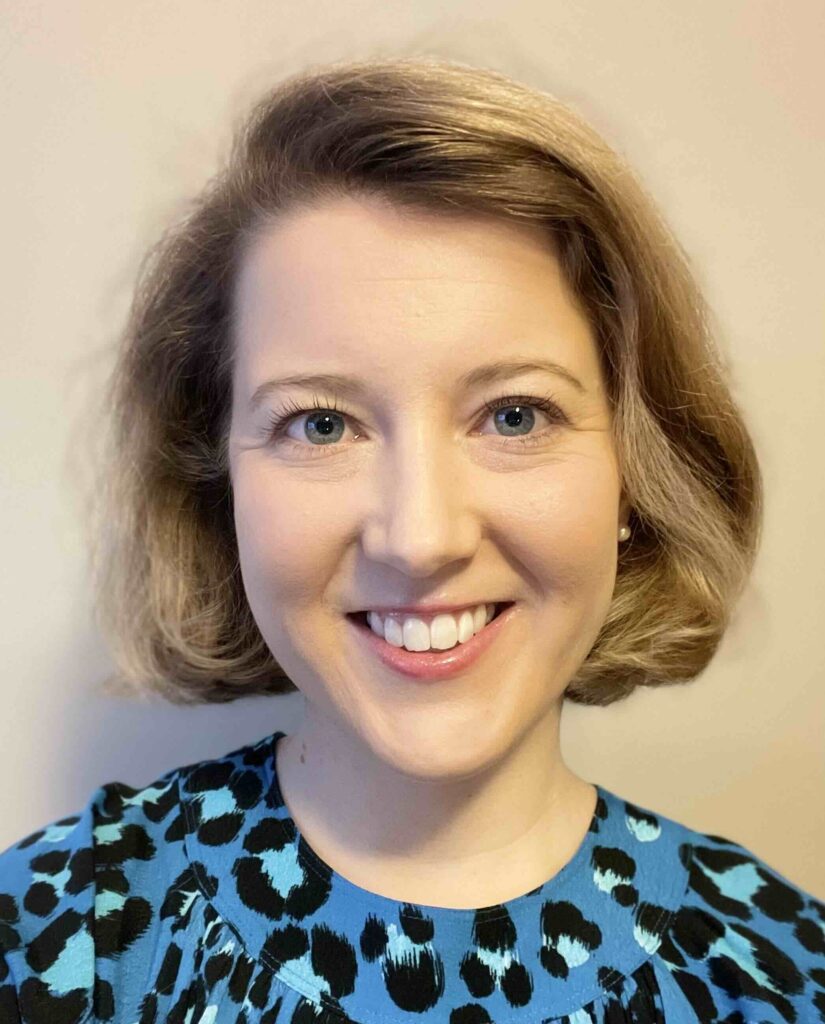 A headshot photo of Anna Littlejohns against a pale background.