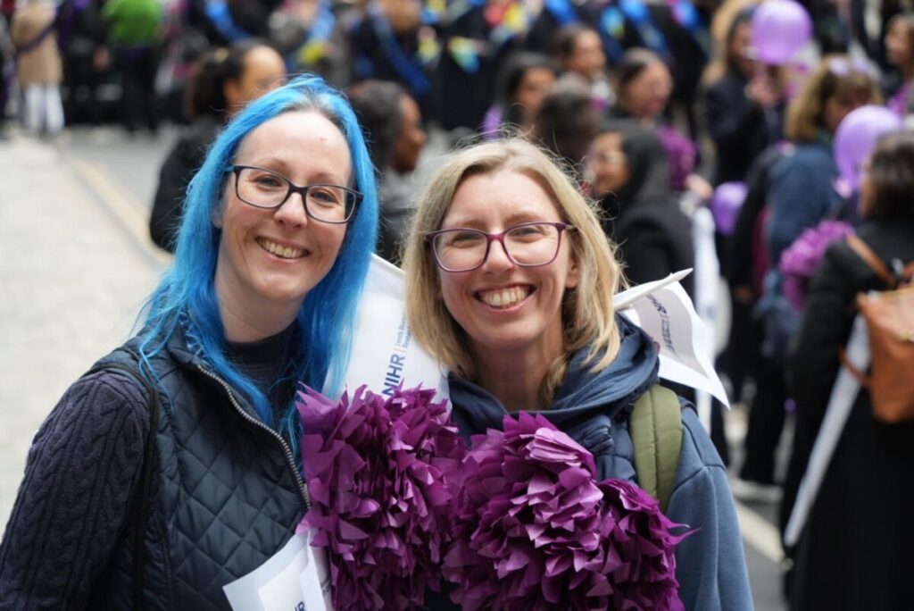 An image of Dr Kerrie Davies on the left and Dr Jane Freeman smiling at the Lady Mayor Show